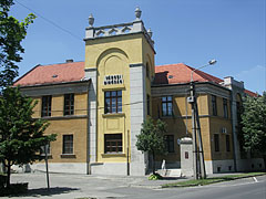The brown and yellow building of the District Court (Town Court) with the characteristic square tower - Kiskunfélegyháza, Hungary